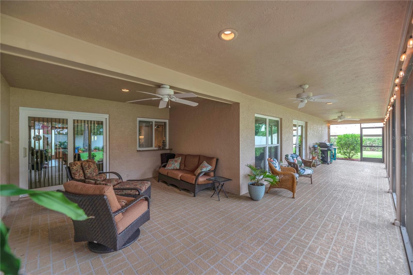 The inviting screened lanai is the perfect spot for morning coffee, evening conversations, and enjoying the peaceful surroundings. - 2421 OAK LANDING DR, BRANDON
