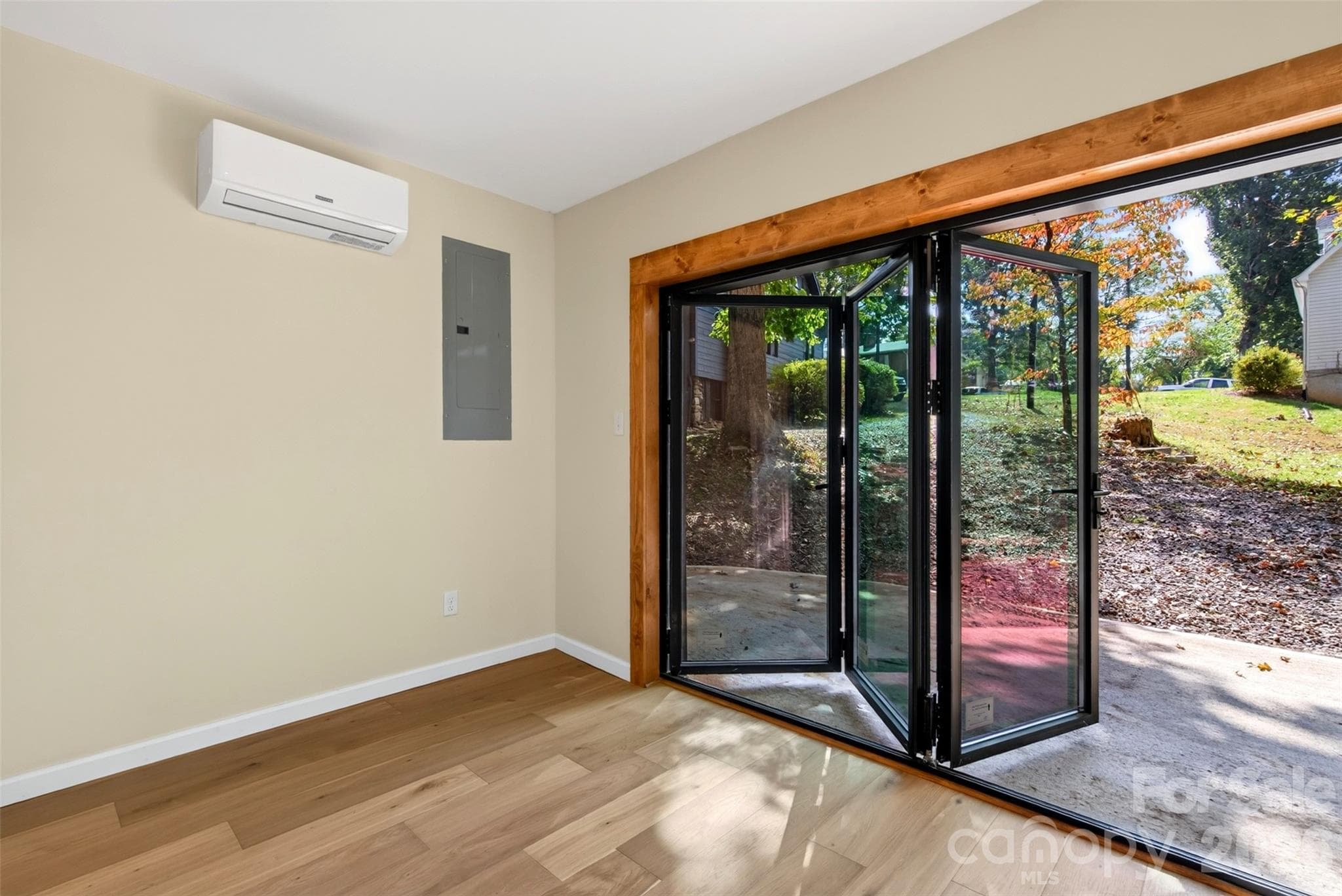 Office/flex space off the bedroom with accordion doors for an indoor/outdoor lifestyle. - 56 Pine Cone Drive, Asheville