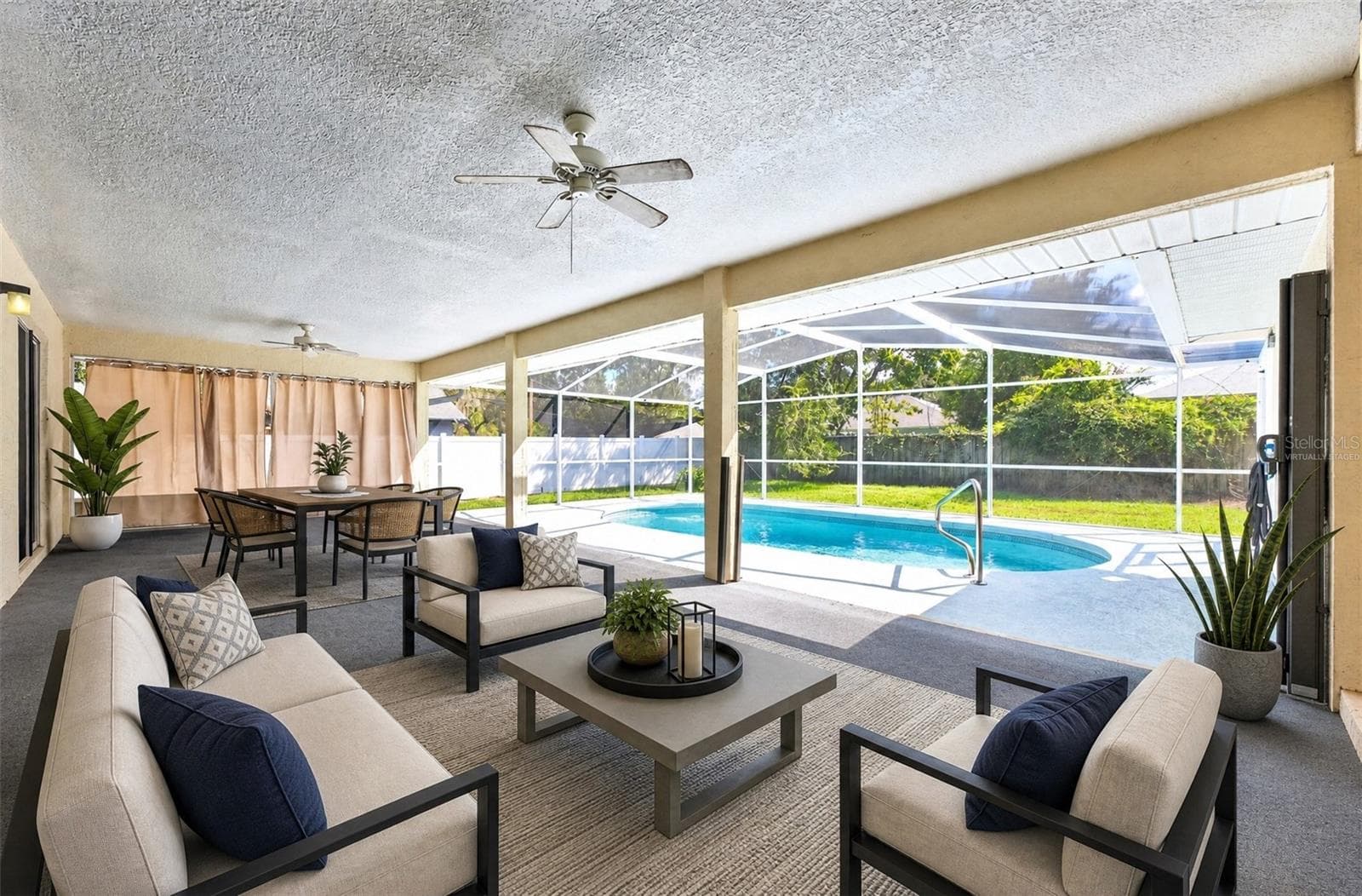 Large covered lanai overlooks the private screened pool and fully fenced backyard. Virtually Staged. - 32919 INDIAN WOODS DR, LEESBURG