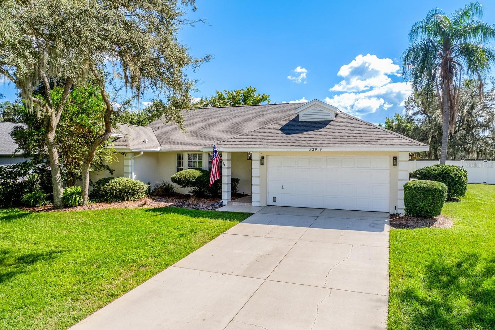 Generous front yard, mature trees, ample parking. - 32919 INDIAN WOODS DR, LEESBURG