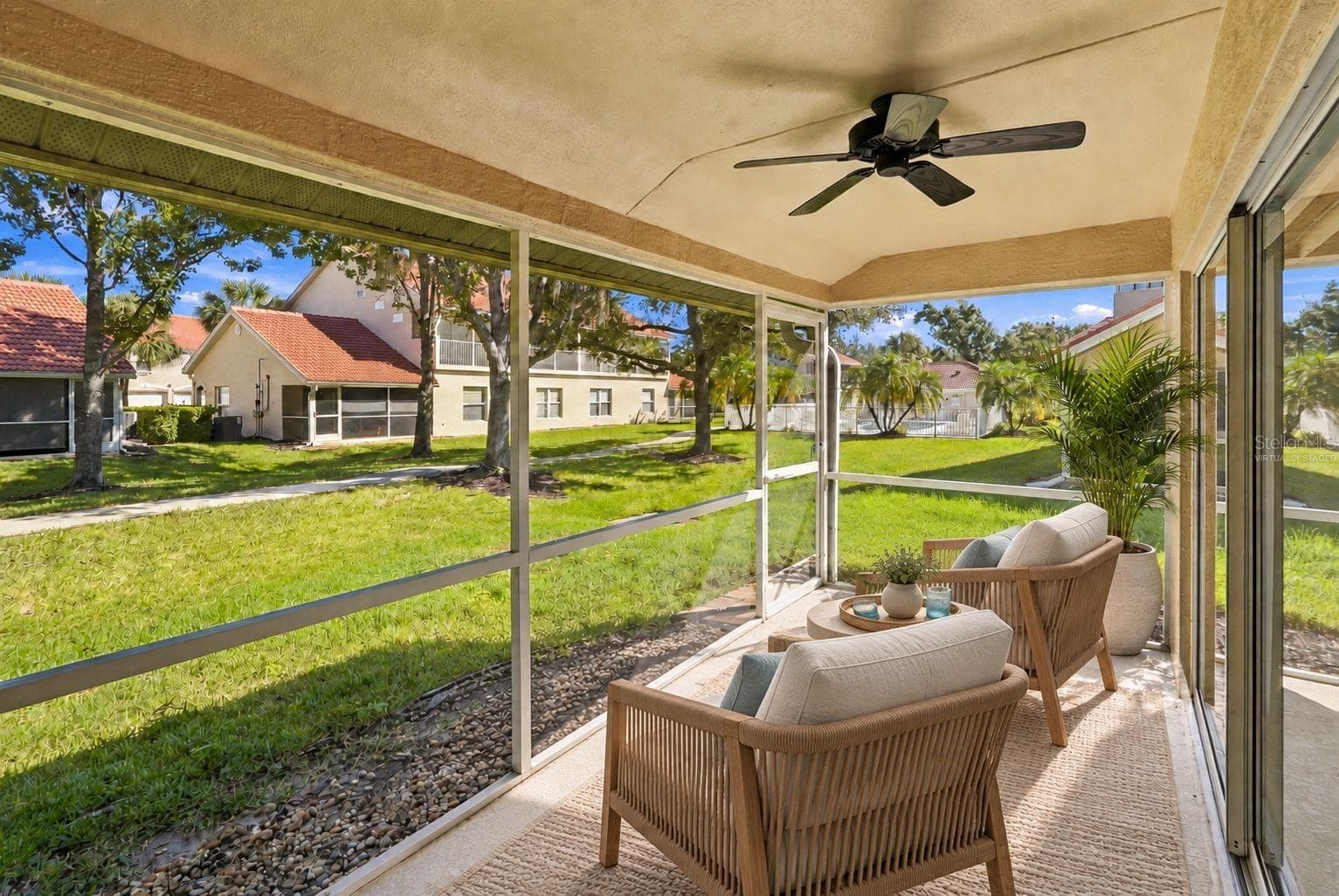 Virtually Staged - Lanai with view of the Community Pool - 7133 CEDAR HOLLOW CIR #22-102, BRADENTON