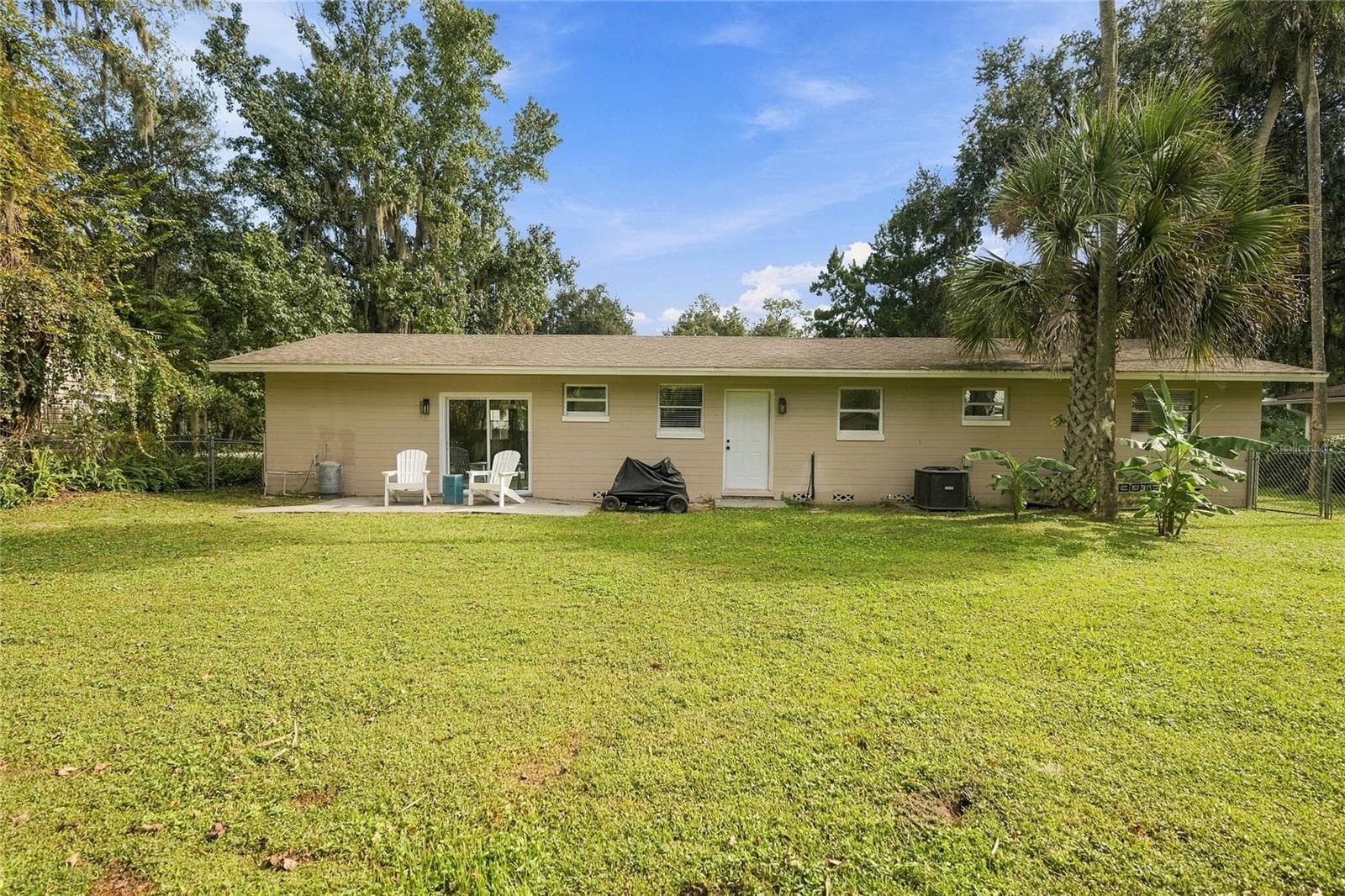 backyard to house - 556 OLIVER DR, NEW SMYRNA BEACH