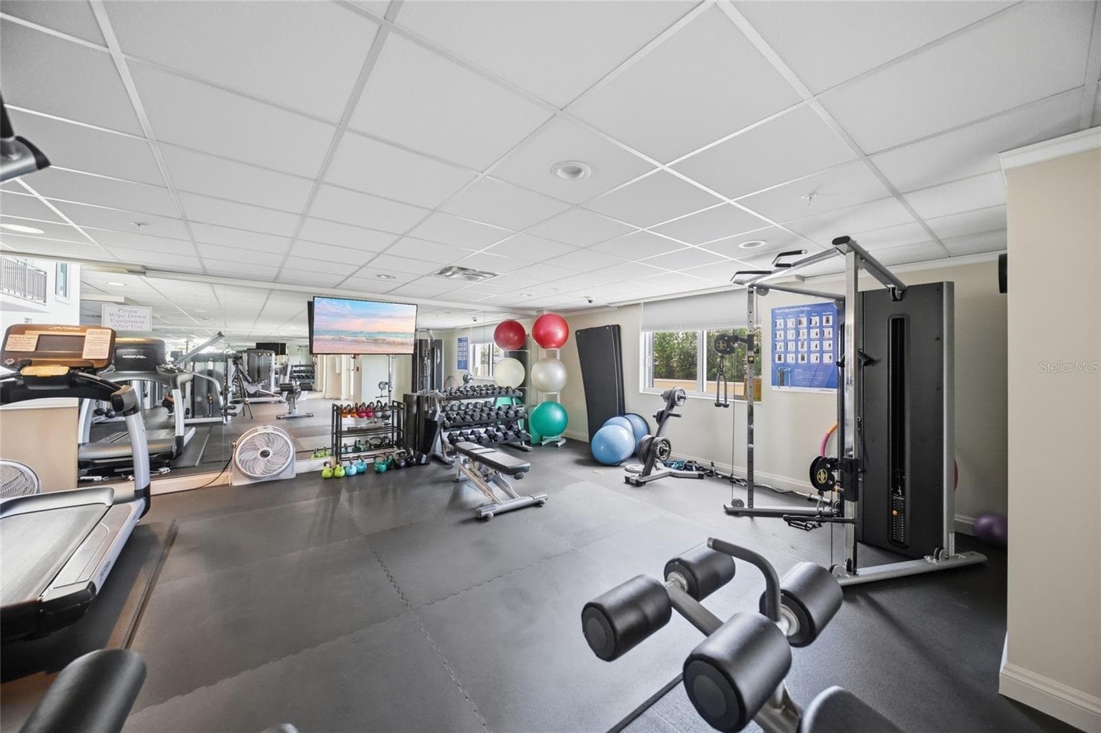 Exercise room opens to pool - 800 N TAMIAMI TRL #201, SARASOTA