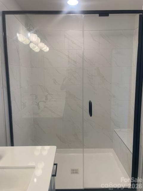 Owners bathroom features large shower with bench 12x24 ceramic tile - 257 Alluvium Lane, Waxhaw