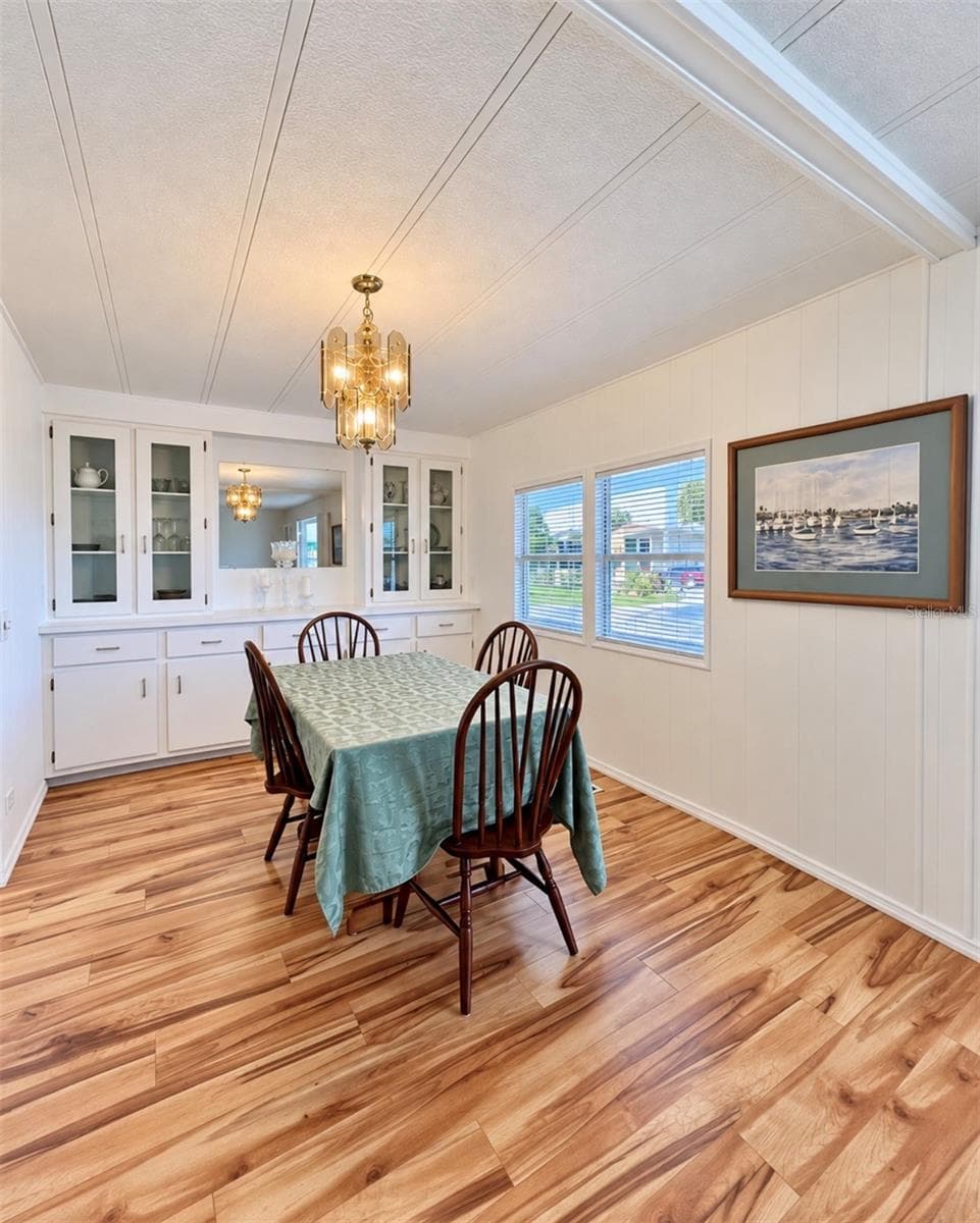 Dining room with built in hutch - 1100 BELCHER RD S #663, LARGO