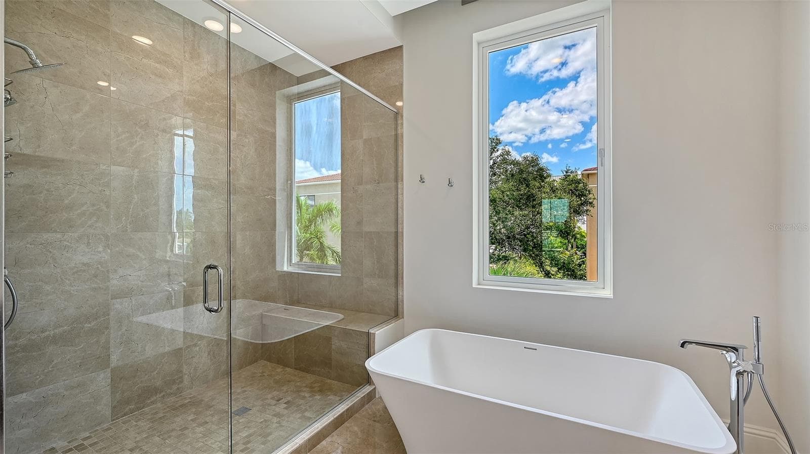 Separate tub and shower in primary bath - 609 GOLDEN GATE PT #301, SARASOTA