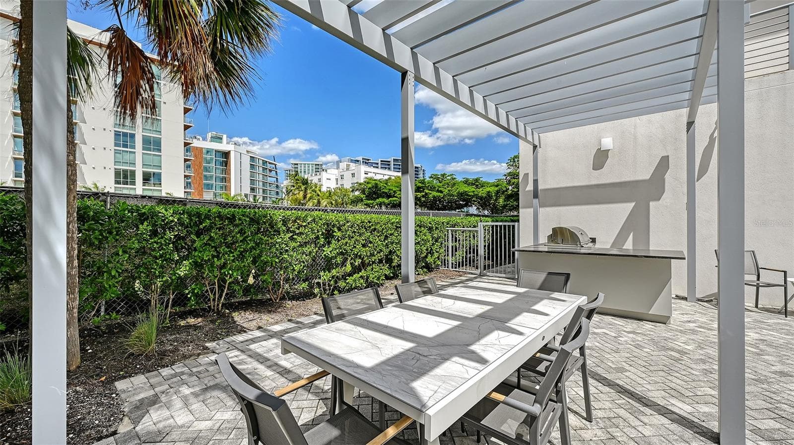 Outdoor eating area and grill area - 609 GOLDEN GATE PT #301, SARASOTA
