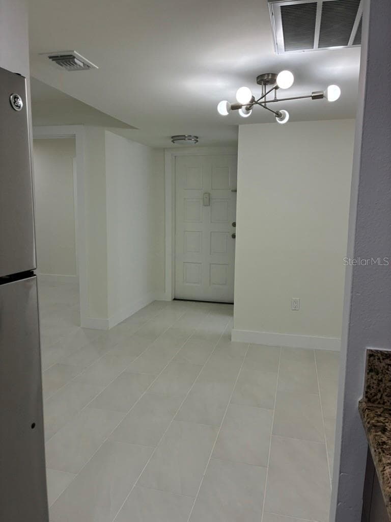 Front door as seen from Kitchen - 5999 VILLAGE CIR #990, ORLANDO