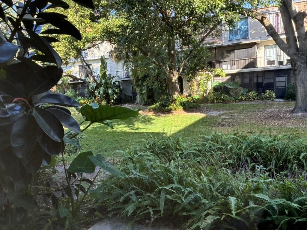 Garden as seen from rear porch - 5999 VILLAGE CIR #990, ORLANDO