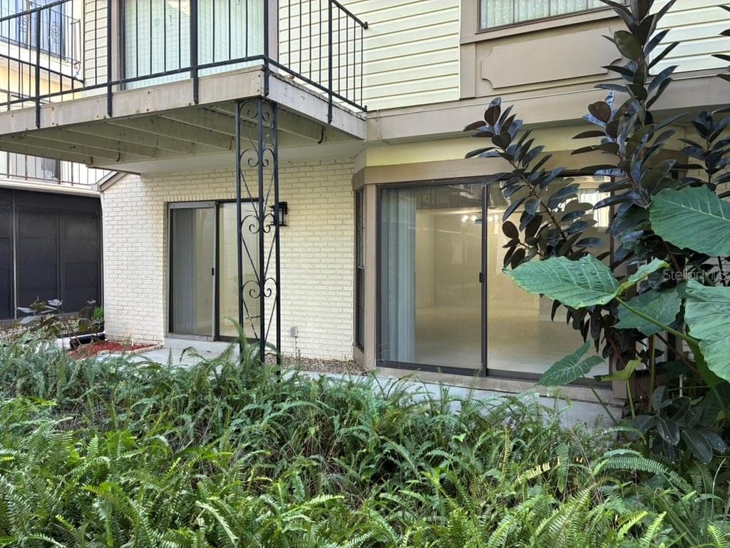 Rear porch as seen from Garden - 5999 VILLAGE CIR #990, ORLANDO