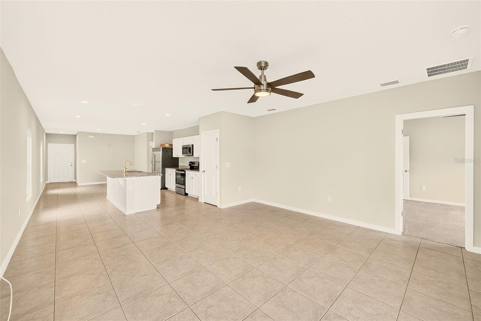 GREAT ROOM TO KITCHEN - 35235 GENDRY ST, ZEPHYRHILLS
