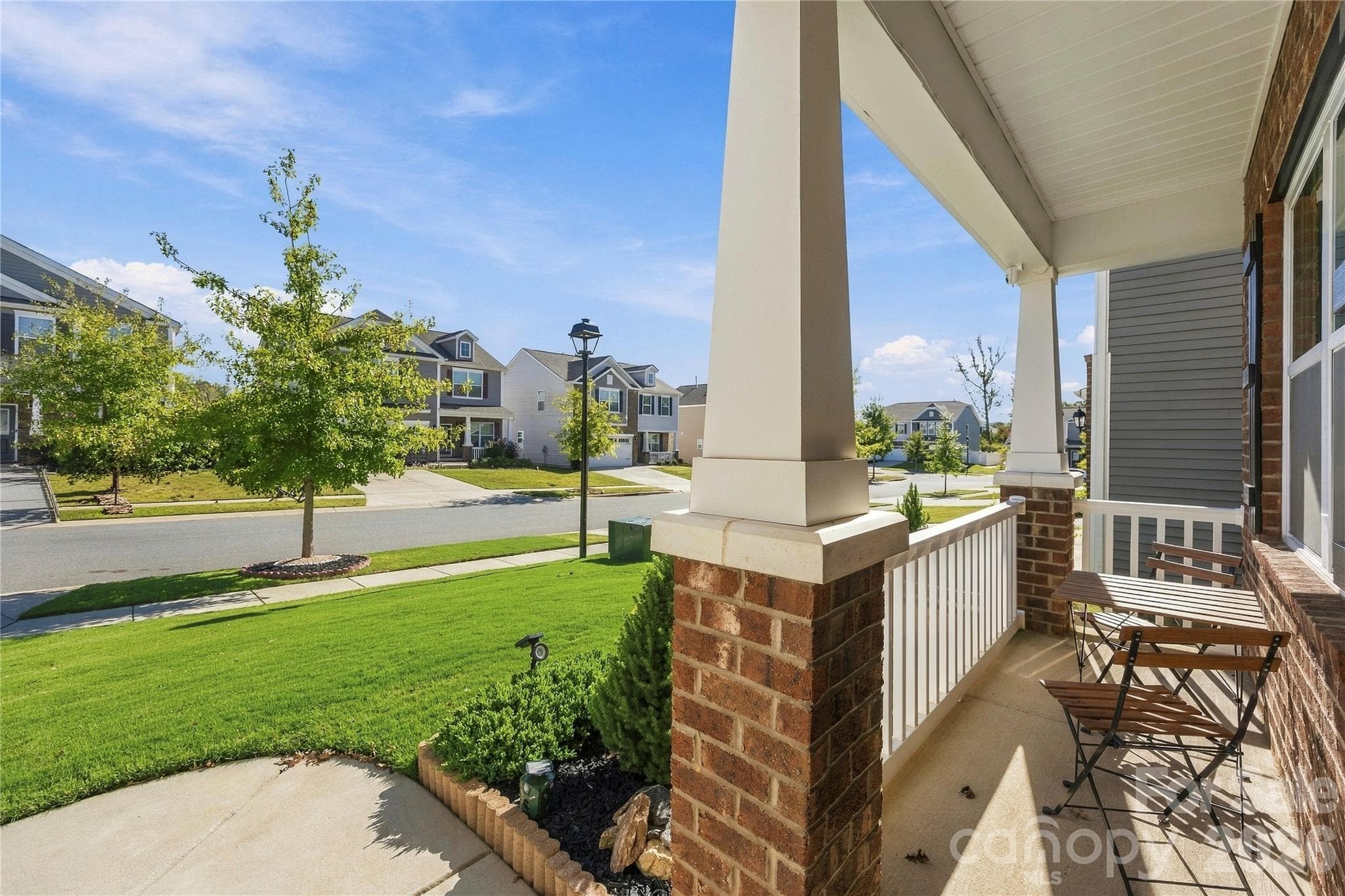 Enjoy easy evenings on the front porch. - 9022 Poquoson Drive, Gastonia
