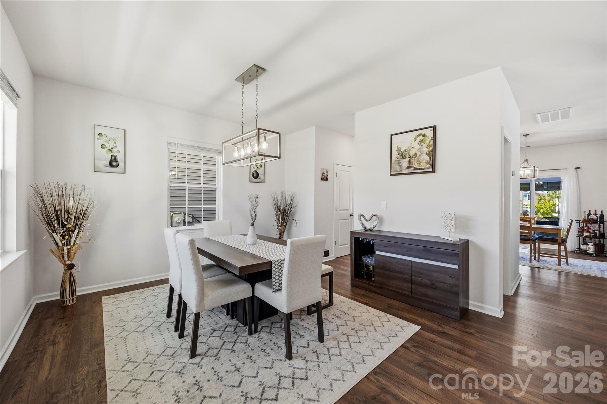 Formal Dining and Entry - pass through walk in pantry with wood shelving. - 9022 Poquoson Drive, Gastonia
