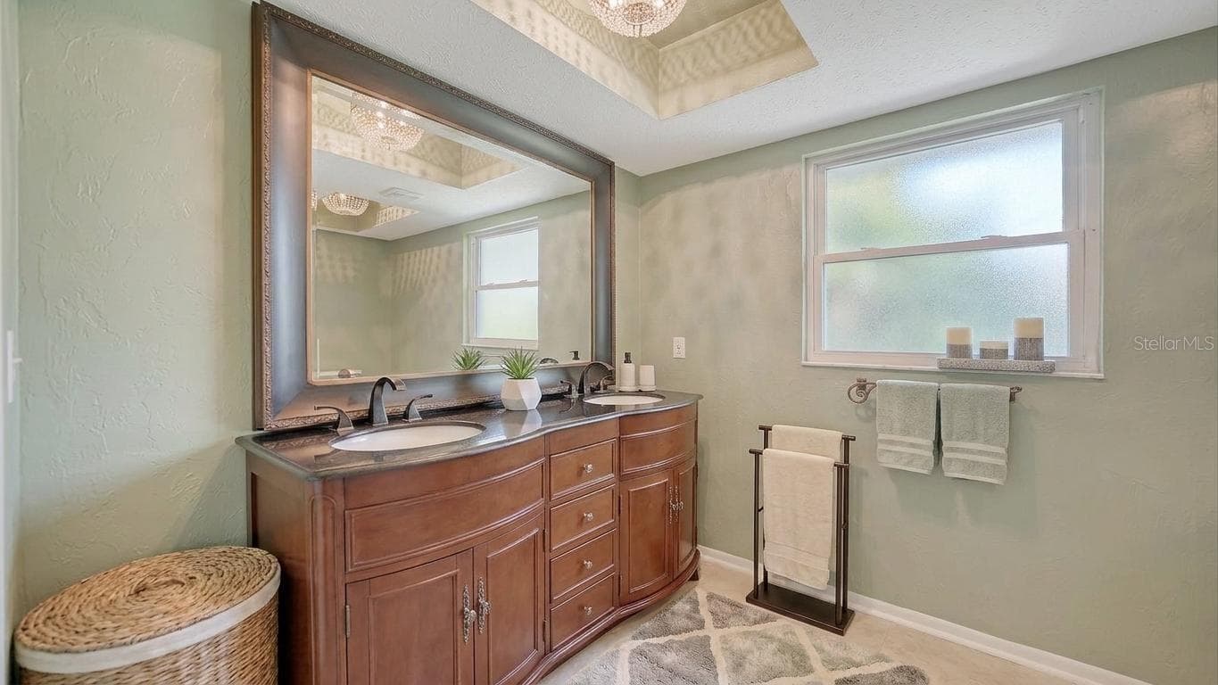 Staged Guest Bathroom with dual sinks - 2295 PINE VIEW CIR, SARASOTA