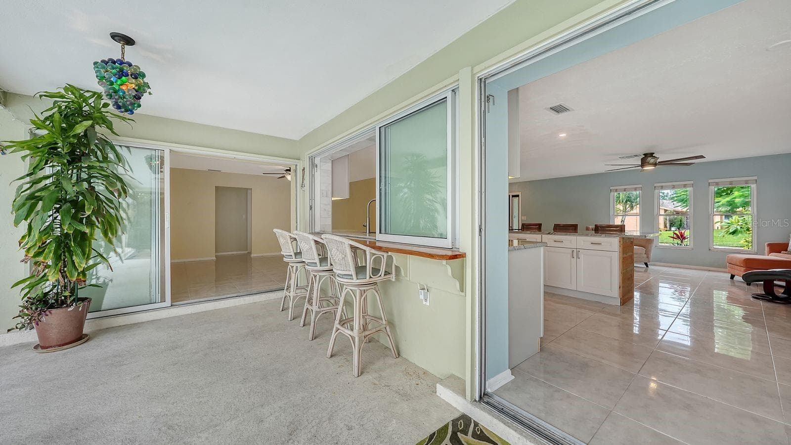 Exterior Bar with a Sliding Pass Thru Window to the Kitchen - 2295 PINE VIEW CIR, SARASOTA