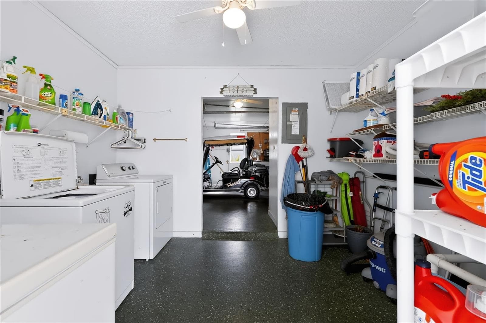 Laundry and storage connected to golf cart garage - 1220 MARIA CT, LADY LAKE