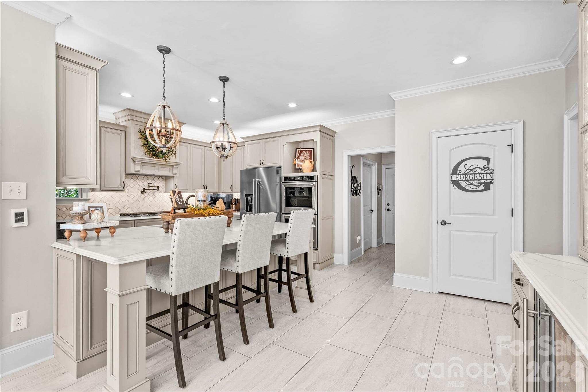 Open and bright kitchen with walk-in pantry,coffee/beverage bar and wine cooler - 220 Cedar Lake Drive, Statesville