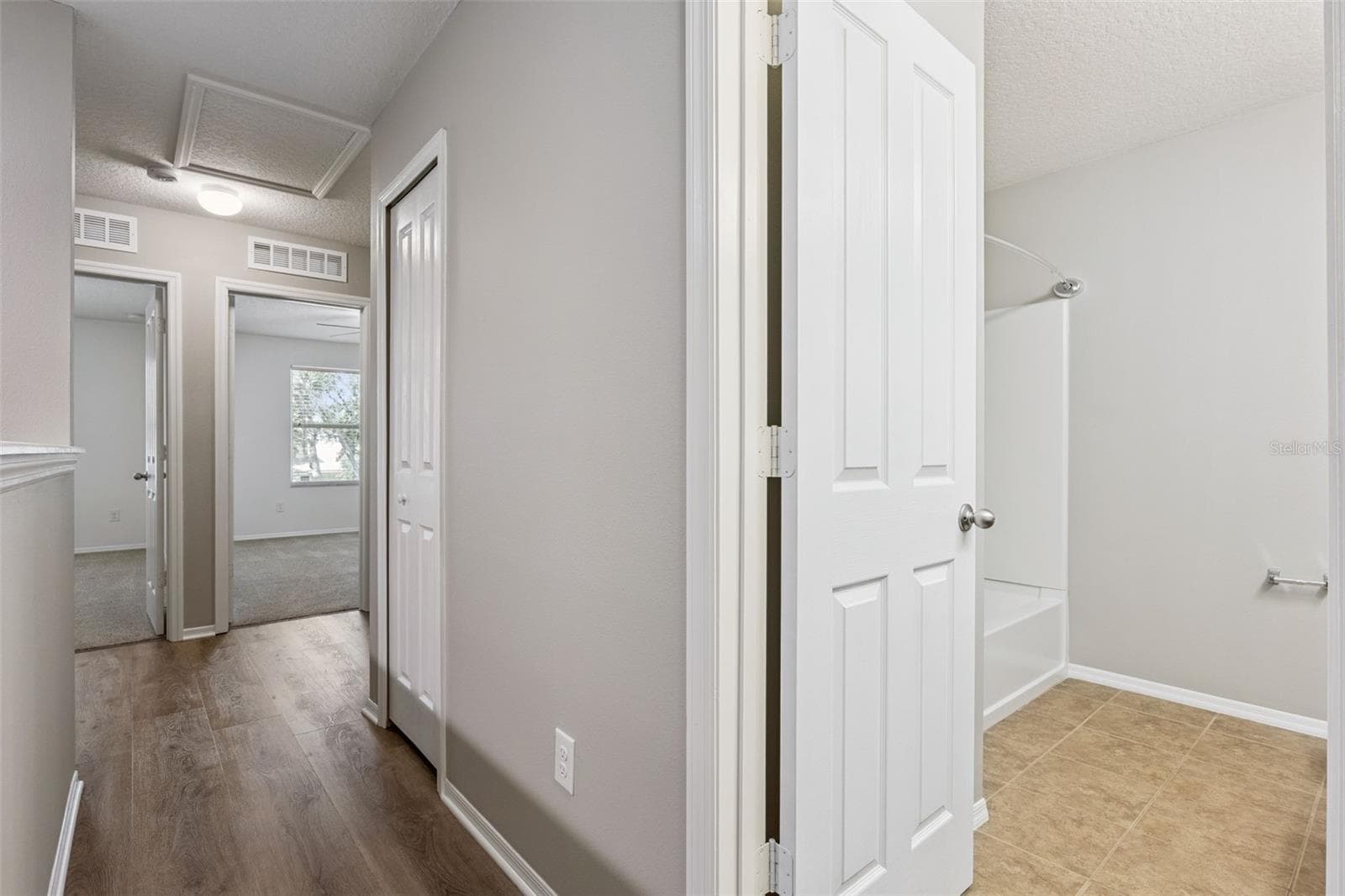 2nd floor hallway leading to bedroom 2 & 3 and bathroom - 13612 LARANJA ST, CLERMONT