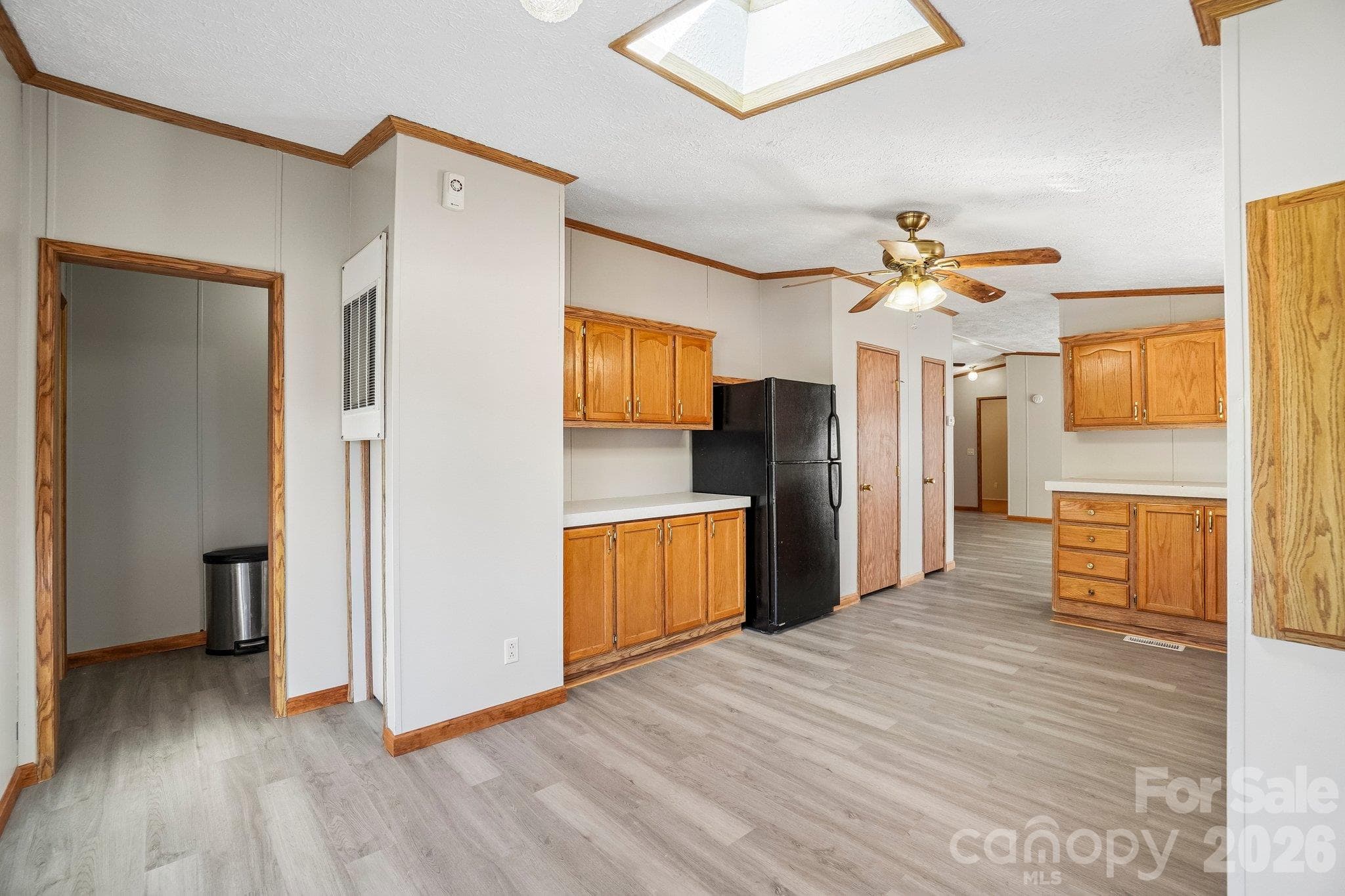 Opposite the dining area, enter the laundry room. - 202 Banyan Road, Candler