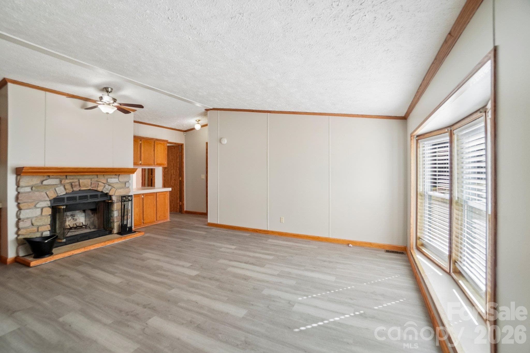 To the right side of the fireplace, access a second full bath, plus two extra bedrooms - 202 Banyan Road, Candler