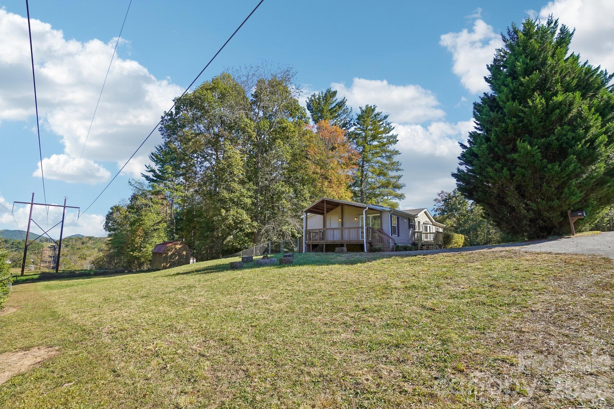 Outside, the large side yard is ideal for fun and games. - 202 Banyan Road, Candler