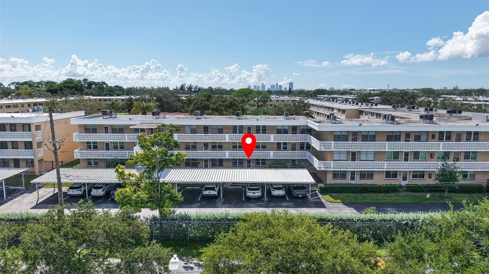 Front of the building with views of downtown St. Pete. - 5095 BAY ST NE #104, ST PETERSBURG