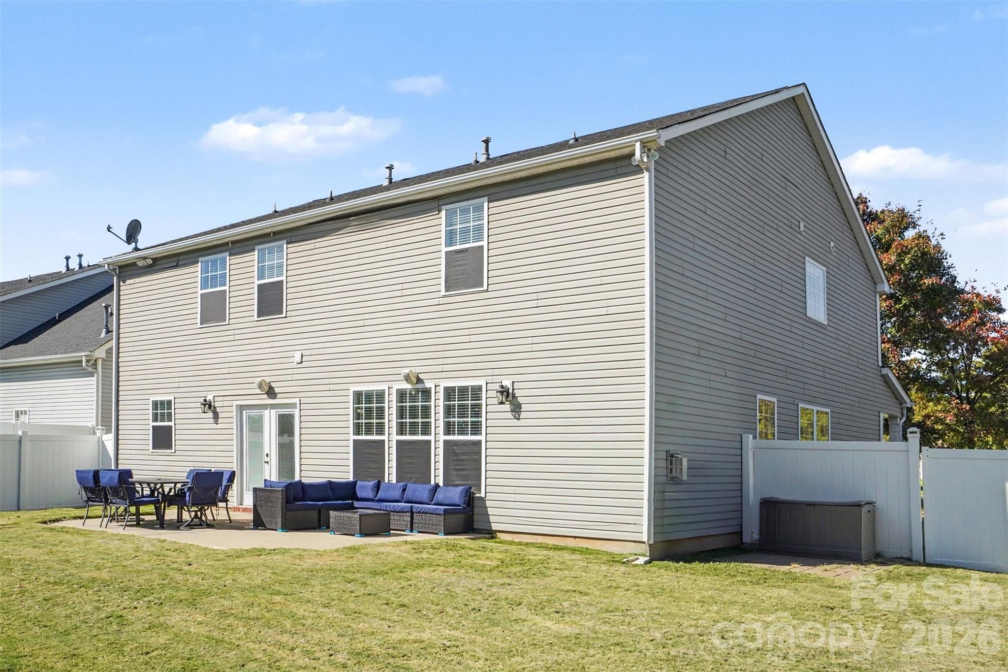 Raar of the home with a spacious patio. Back Yard Featurs a Privacy Fence. - 3585 Leighton Drive SW, Concord