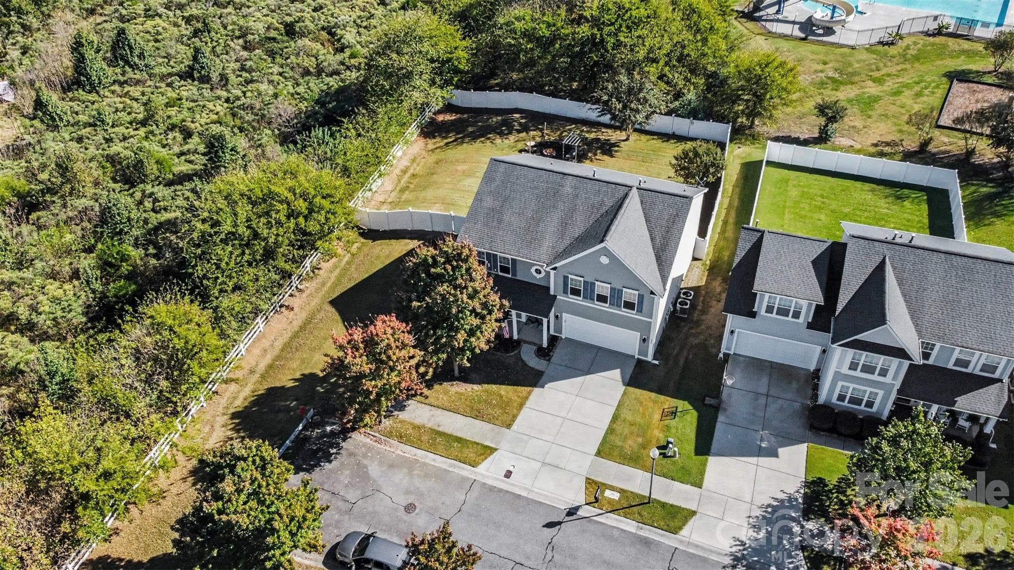Check out the community pool peeking out of the corner behind your new home. Home is on the left for reference. - 3585 Leighton Drive SW, Concord