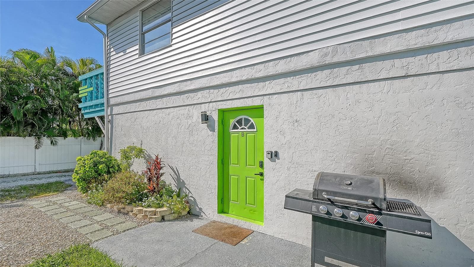 Both units have left side entrances. Green door, Unit B. Both units have a propane grill. - 2514 AVENUE B, BRADENTON BEACH