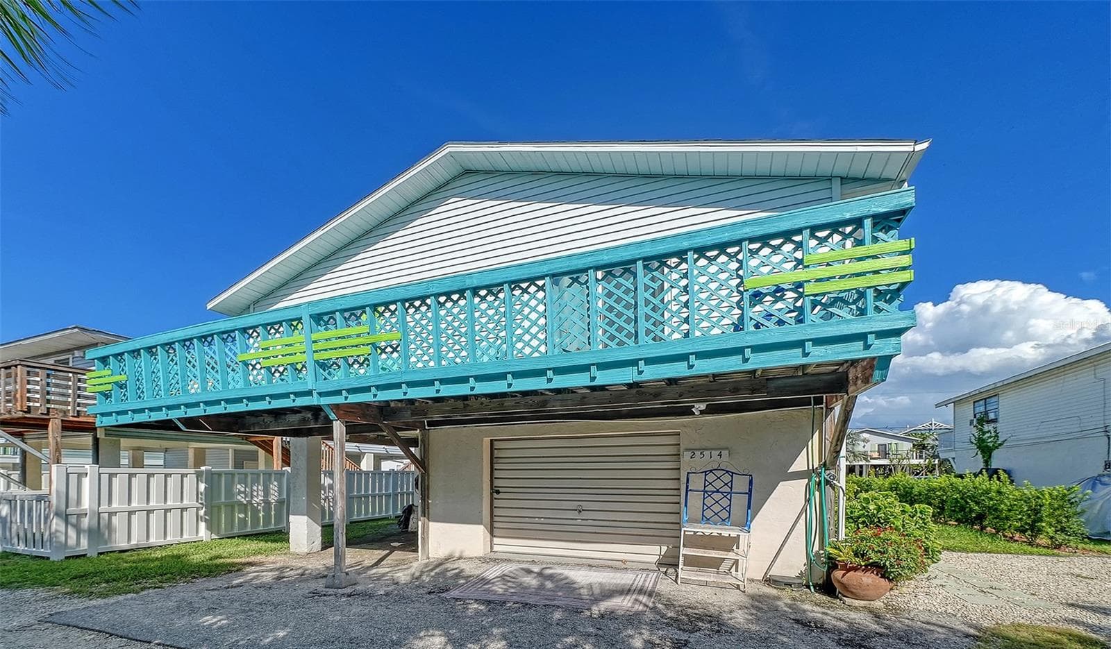 Rear of 2514 Avenue B. Converted garage has been changed to storage area/game room. - 2514 AVENUE B, BRADENTON BEACH