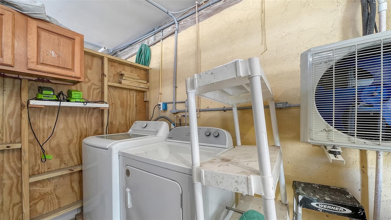 Exterior common laundry room/storage space on the ground floor. - 2514 AVENUE B, BRADENTON BEACH
