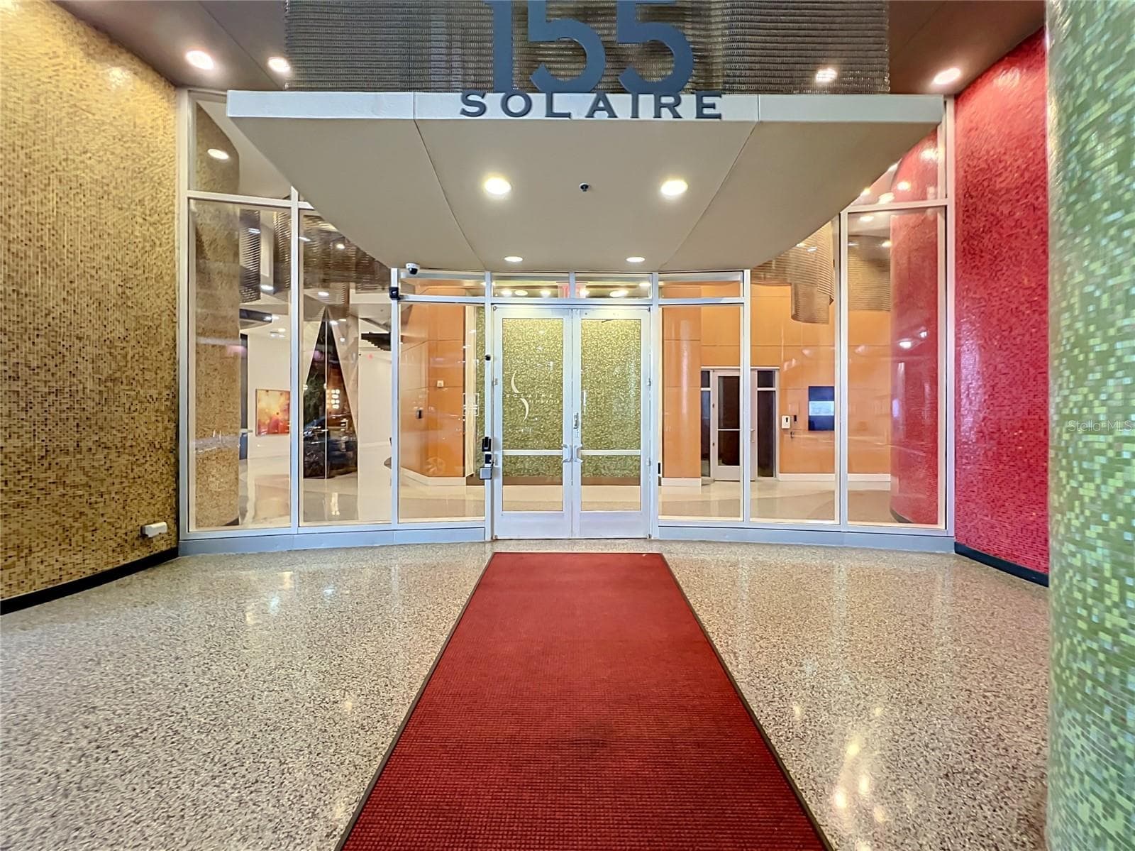 Covered entryway with security features and 24 hour concierge. - 155 S COURT AVE #2107, ORLANDO