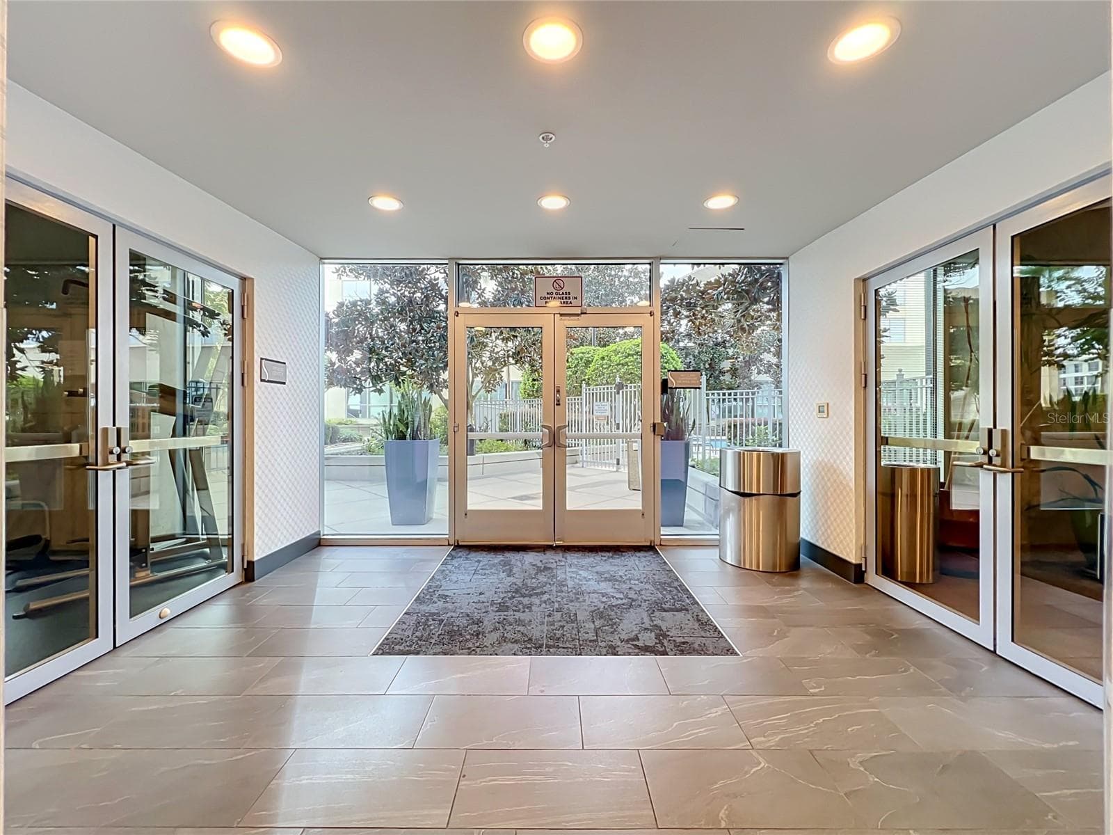 Entrance to pool and outdoor garden area, as well as gym and - 155 S COURT AVE #2107, ORLANDO