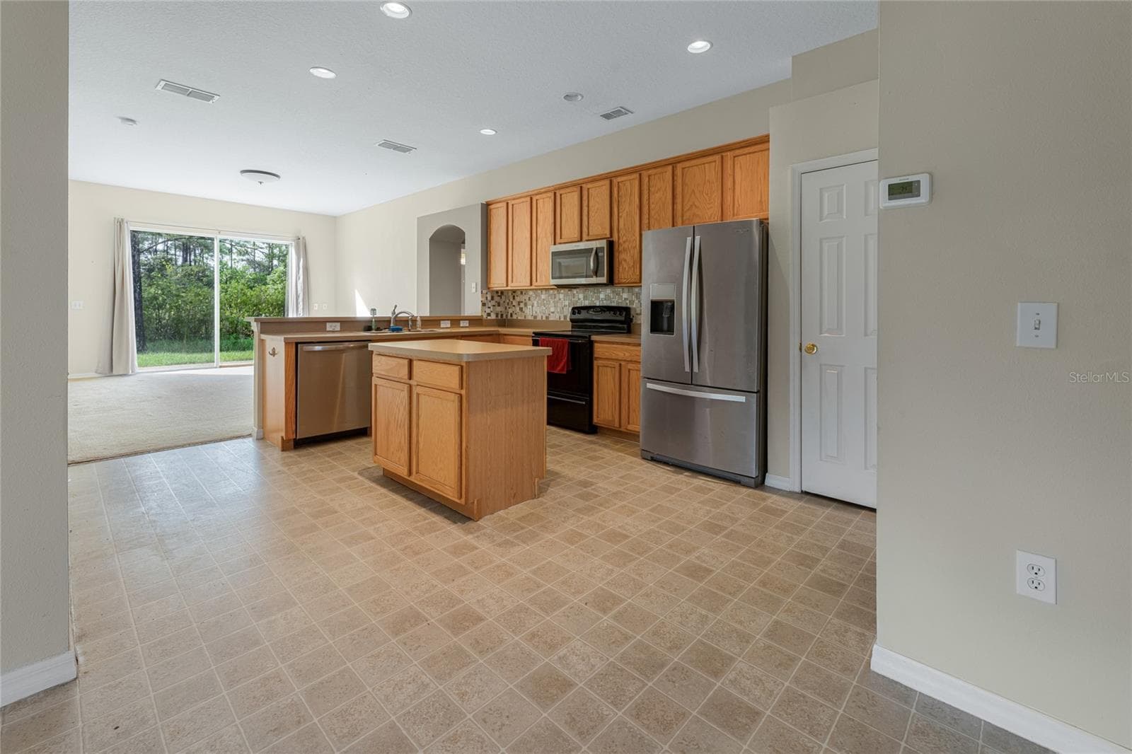 Kitchen area from front door area - 3626 BENSON PARK BLVD, ORLANDO