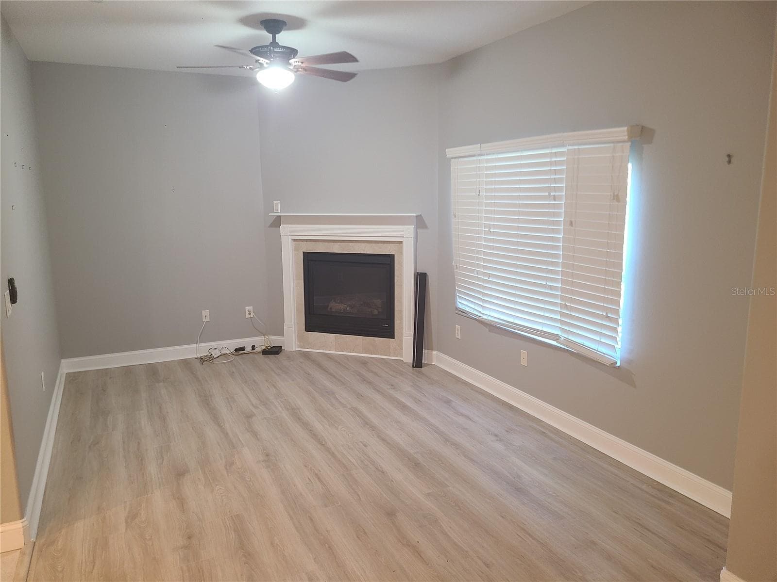 Second Floor Living Room with Gas Burning Fireplace - 6517 SAND SHORE LN, NEW PORT RICHEY