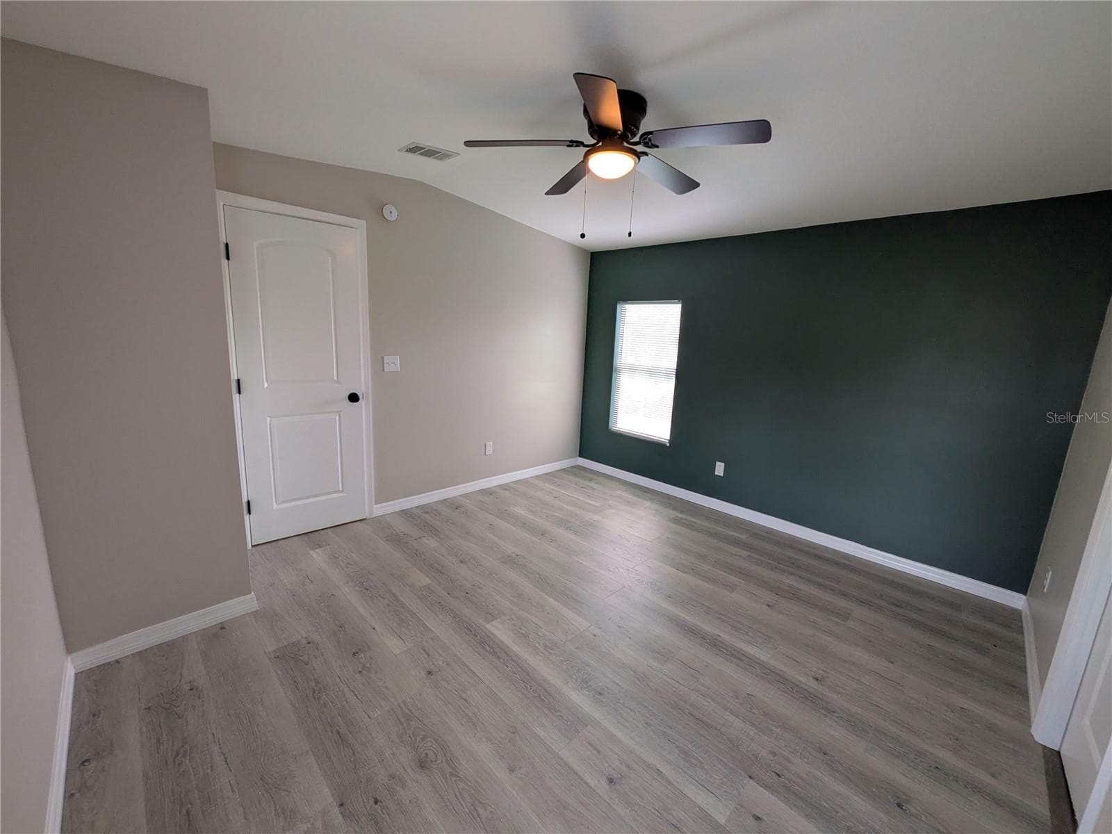 PRIMARY BEDROOM FROM WALK-IN CLOSET - 3125 BAYBERRY AVE, PUNTA GORDA