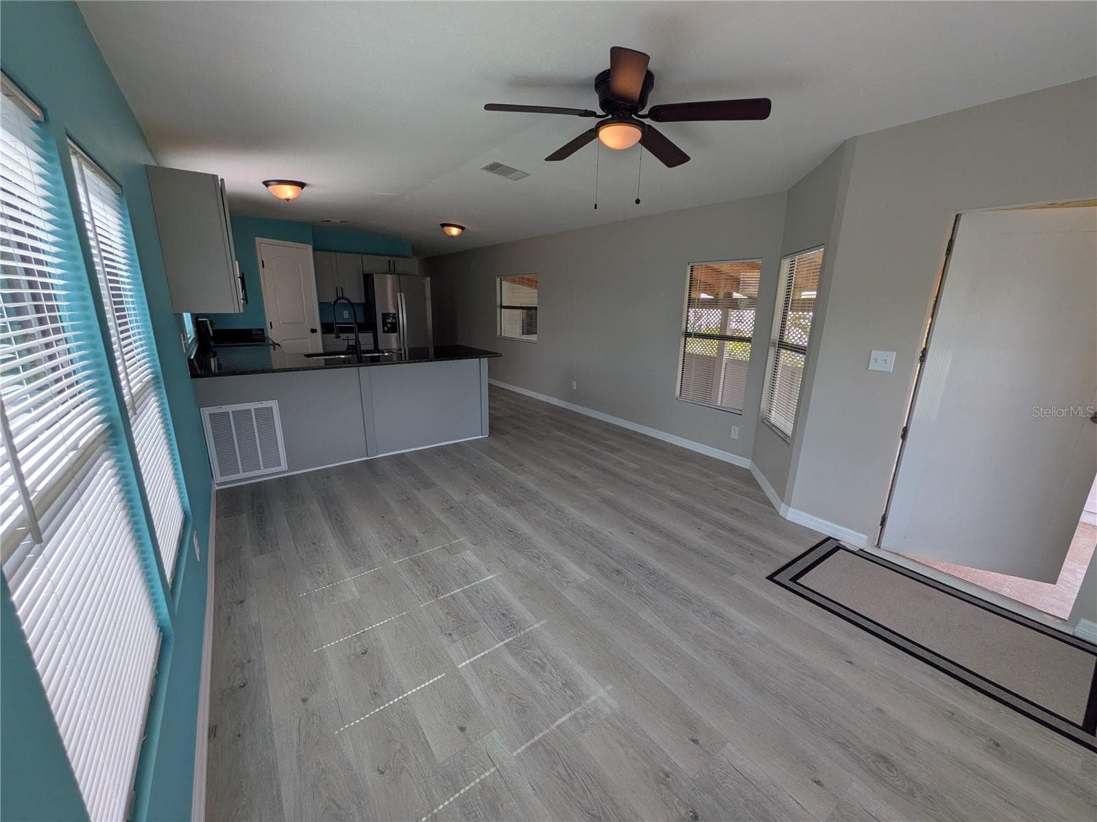 LIVING AREA FACING KITCHEN - 3125 BAYBERRY AVE, PUNTA GORDA