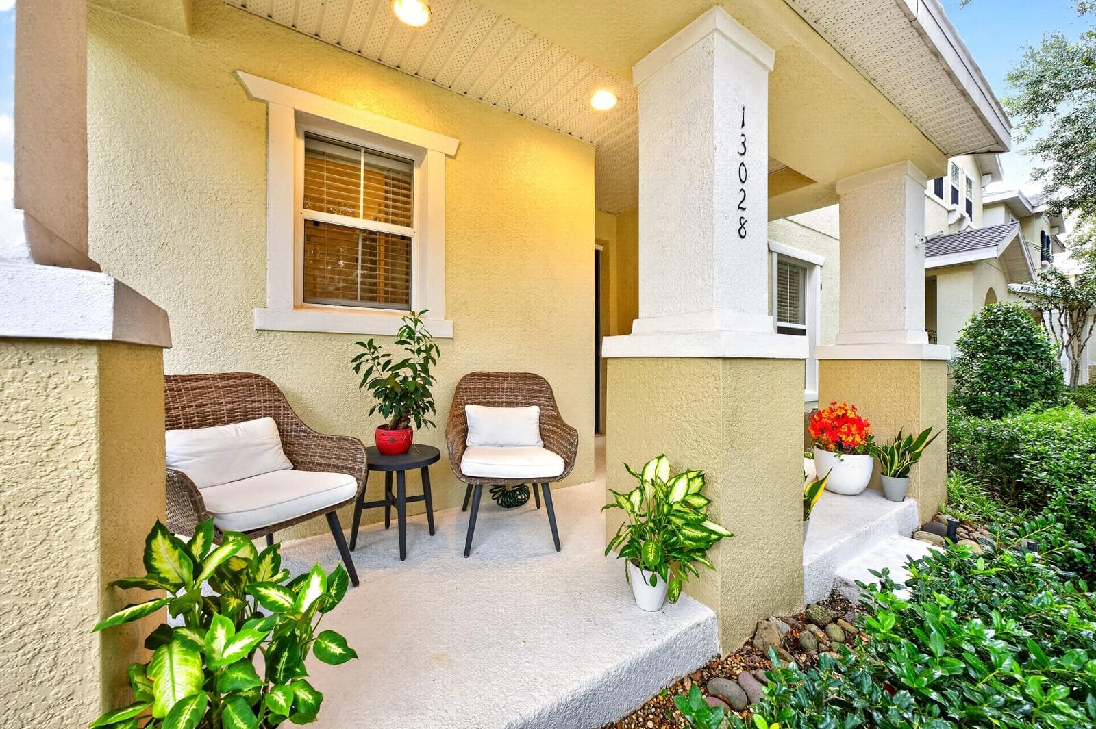 A charming covered front porch welcomes you. - 13028 AUBURN COVE LN, ORLANDO