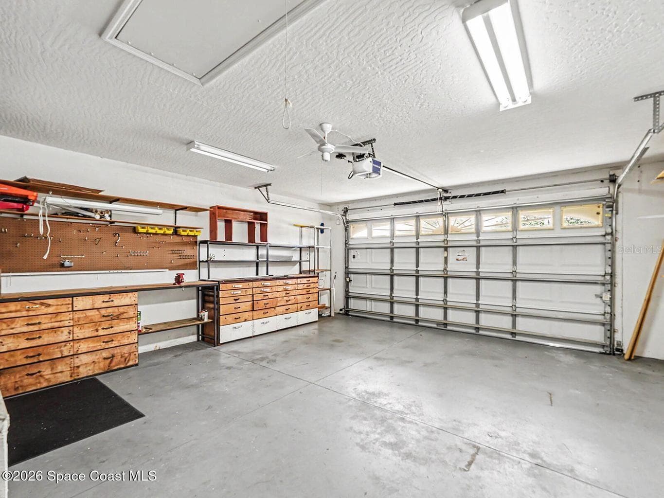 Garage with Workbench - 1882 BARRINGTON CIR, ROCKLEDGE