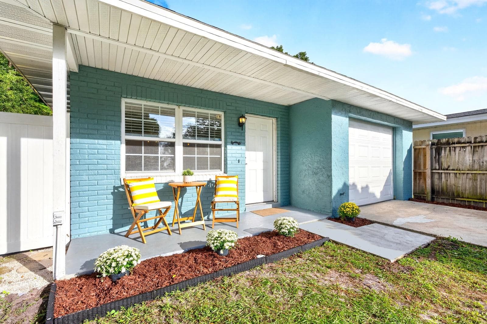 The garage adds another useful feature, with an EPOXY-COATED FLOOR and WINDOW AC UNIT that create a comfortable spot for workouts, hobbies or projects. - 543 HIBISCUS WAY #9C, ORLANDO