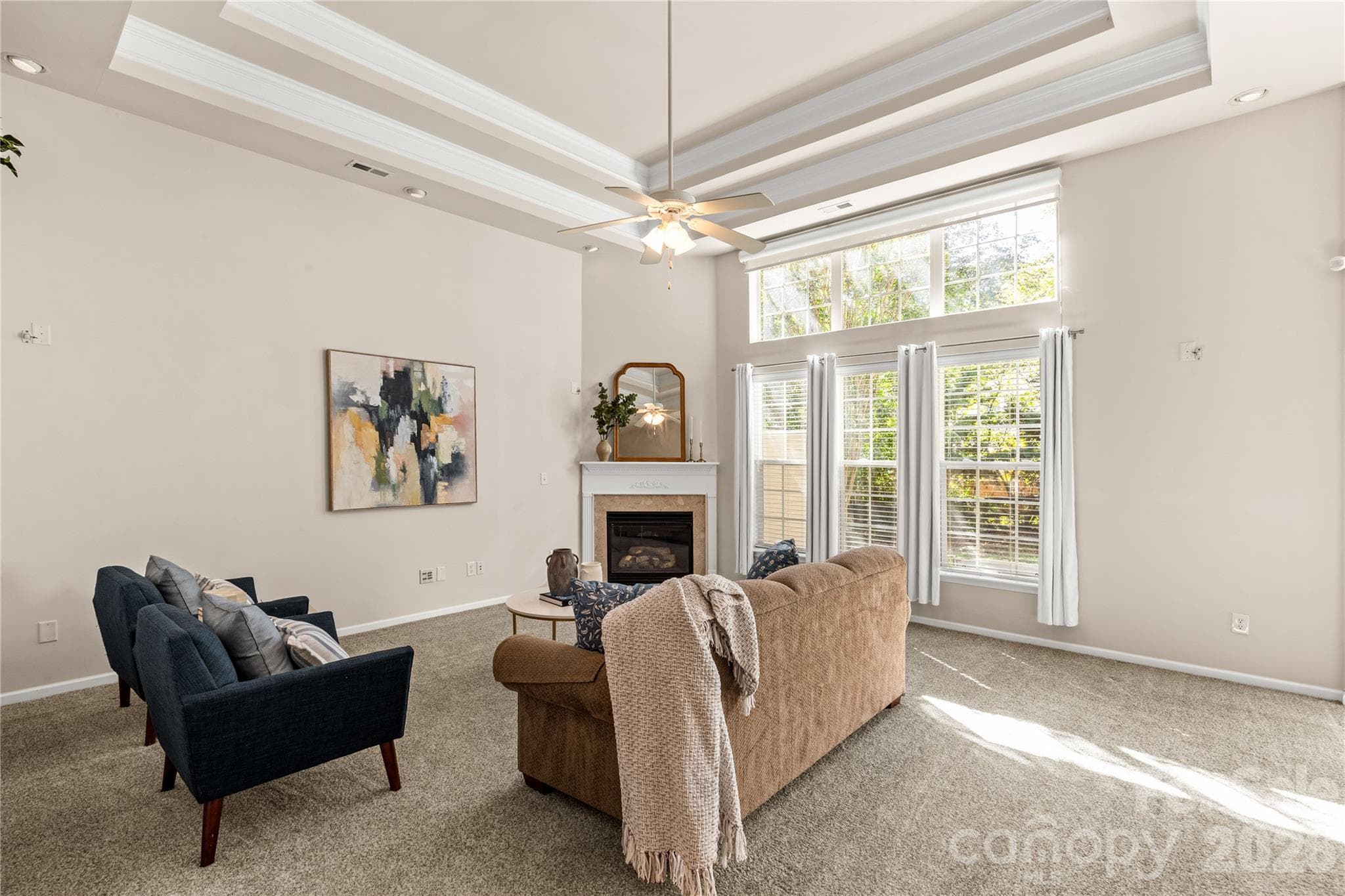 Wall of windows and 12 ft ceilings in living room - 3820 Planters Watch Drive, Charlotte