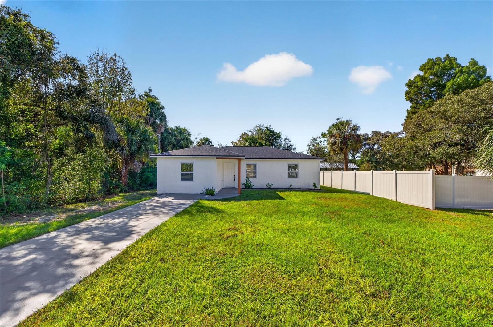 Extended driveway offers parking for up to four vehicles. - 16107 SEA PINES DR, HUDSON
