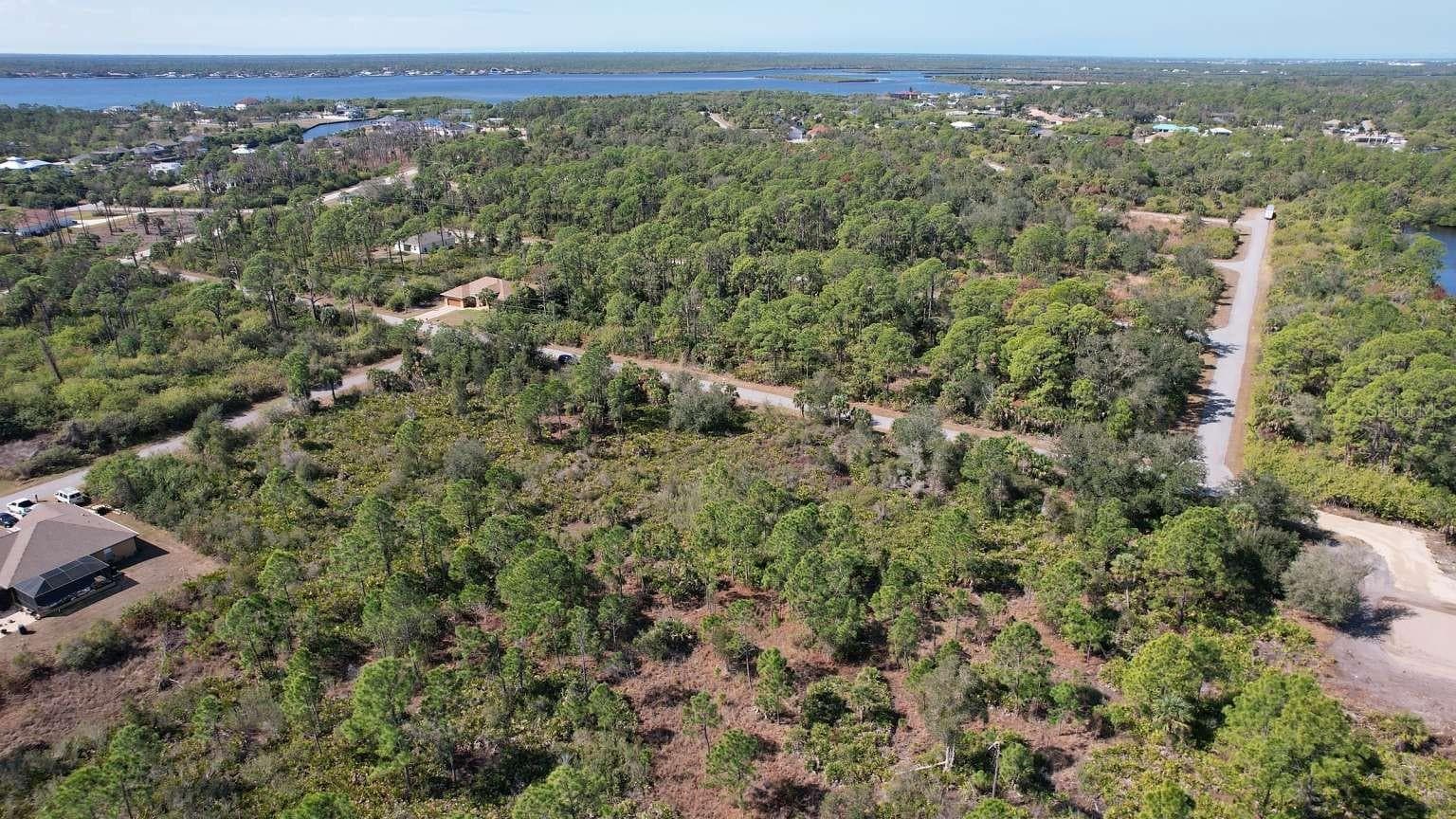 Aerial view of surrounding area; nearby water is not part of the property. - 1262 SANFORD ST, PORT CHARLOTTE