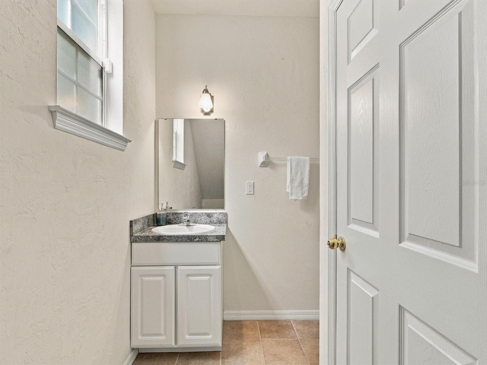 First Floor Half Bath - Storage, Sink, and Toilet - 11644 NW 18TH PL, GAINESVILLE