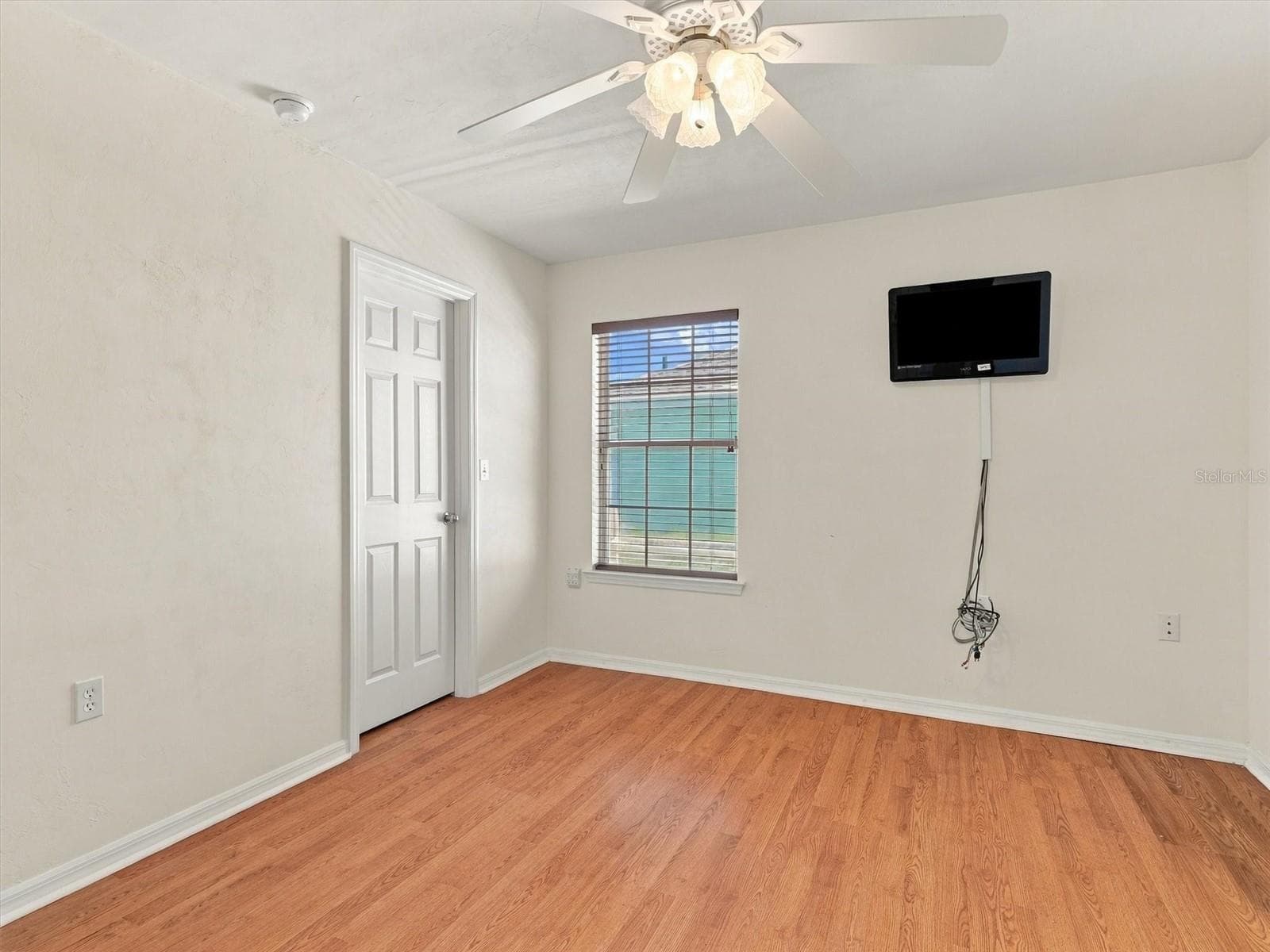 Bedroom 2 - Walk in Closet with mounted TV - 11644 NW 18TH PL, GAINESVILLE