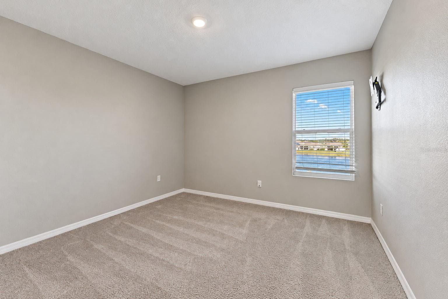 Secondary bedroom pond-facing window - 5126 Jackel Chase Dr, Wimauma - 5126 JACKEL CHASE DR, WIMAUMA