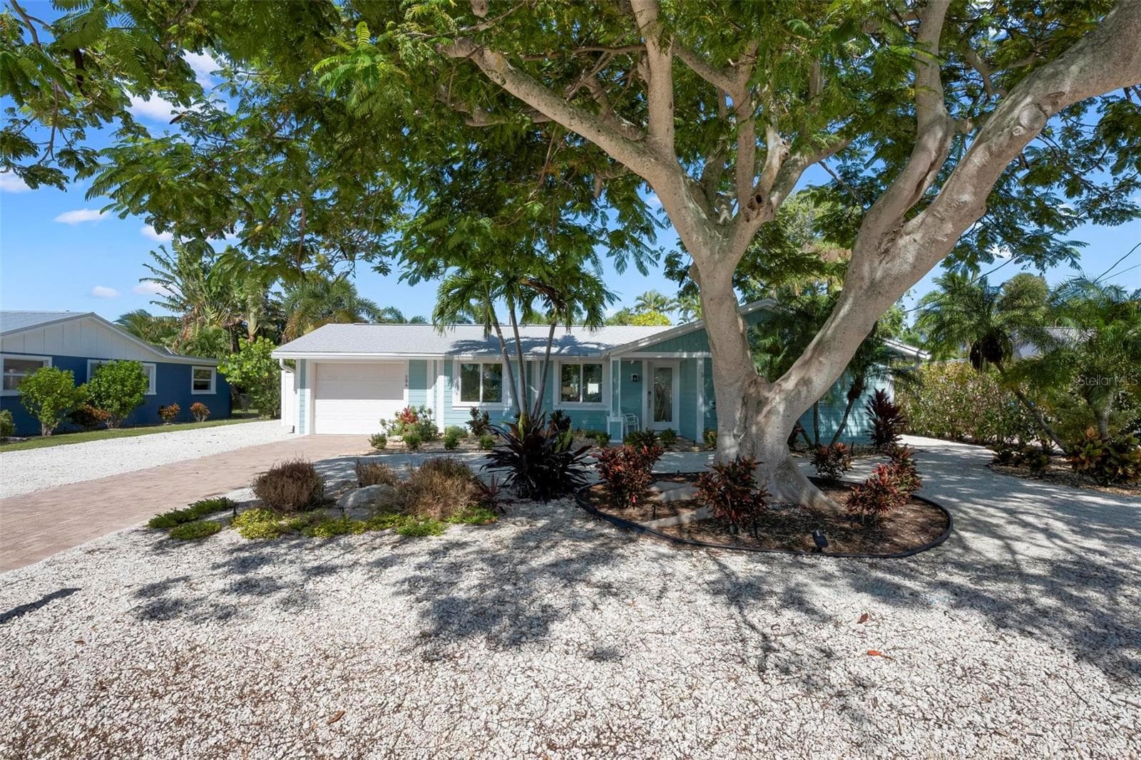 Front of home with beautiful poinciana tree - 504 69TH ST, HOLMES BEACH