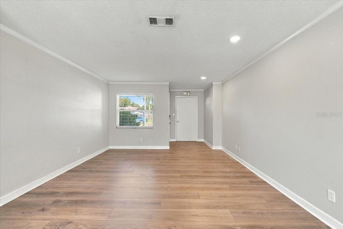 Large living room off the entryway and closet - 5220 90TH TER N, PINELLAS PARK