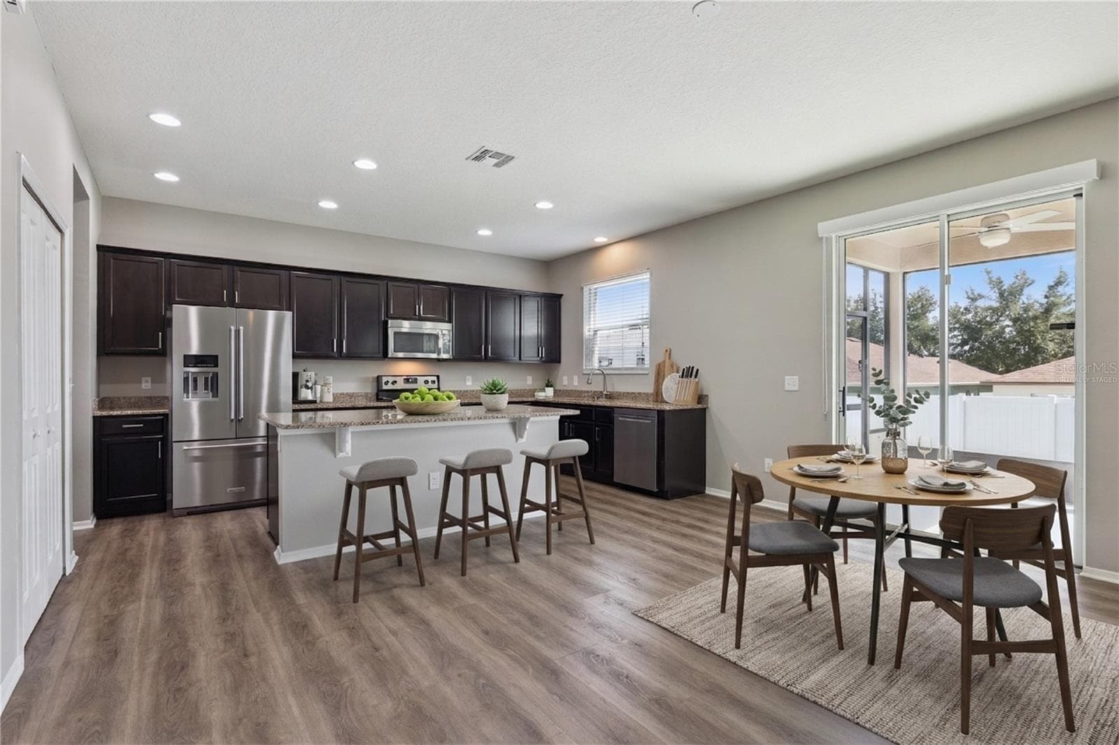 Virtually staged breakfast nook & kitchen - 13612 LARANJA ST, CLERMONT