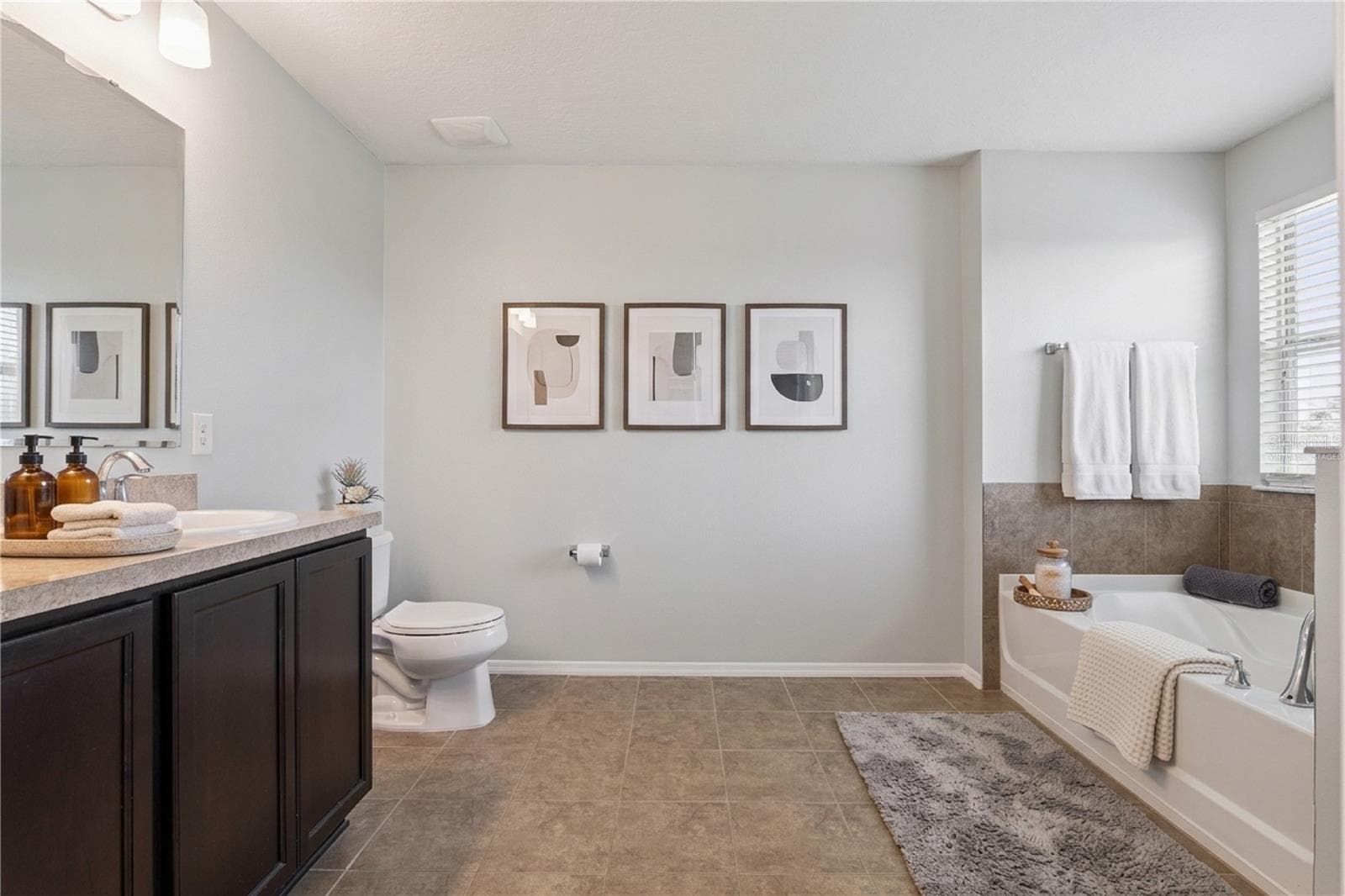 Virtually staged. Primary bath - 13612 LARANJA ST, CLERMONT